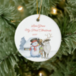 Cute Snowman and Reindeer 1st Christmas Ceramic Tree Decoration<br><div class="desc">Baby 1st Christmas photo ornament with a cute snowman and reindeer in front of a warmly lit cabin in the snow. The template is ready for you to edit the text on the front and add your favourite photo on the back. The photo is displayed in square shape, so if...</div>