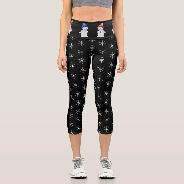 Cute snowman and snowflake pattern on black capri leggings (Front)