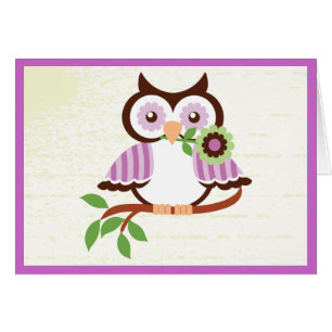 Cute spring owl holding a flower in her beak