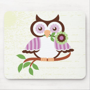 Cute spring owl holding a flower in her beak mouse mat