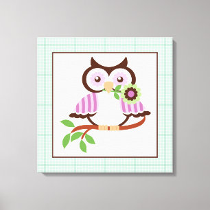 Cute spring owl on a branch wrapped canvas print