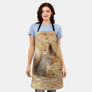 Cute squirrel eats a nut photo apron