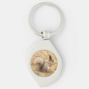 Cute squirrel eats a nut photo key ring