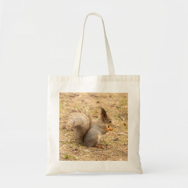Cute squirrel eats a nut photo tote bag (Front)