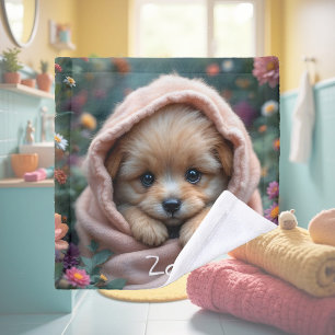 Cute, tiny, fluffy puppy surrounded by flowers wash cloth