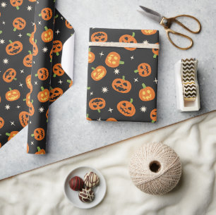 Cute tossed Halloween Pumpkins pattern on black Wrapping Paper