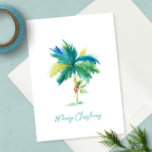 Cute Tropical Palm Tree Christmas Greeting Card<br><div class="desc">Celebrate the sunshine this Christmas in July 2025 with a cute and coastal twist! This tropical Christmas card features a vibrant watercolor palm tree adorned with a festive red poinsettia—set against a crisp white background with “Merry Christmas” written in modern turquoise brush script. It’s the perfect way to send warm...</div>