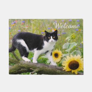 Cute tuxedo cat on a tree branch with sunflowers - doormat
