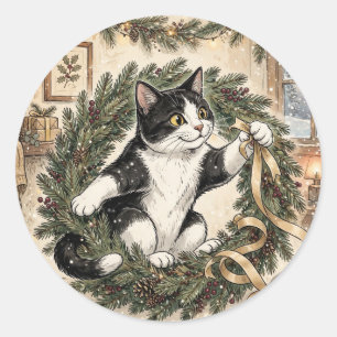 Cute Tuxedo Cat Peeking Over Christmas Wreath with Classic Round Sticker