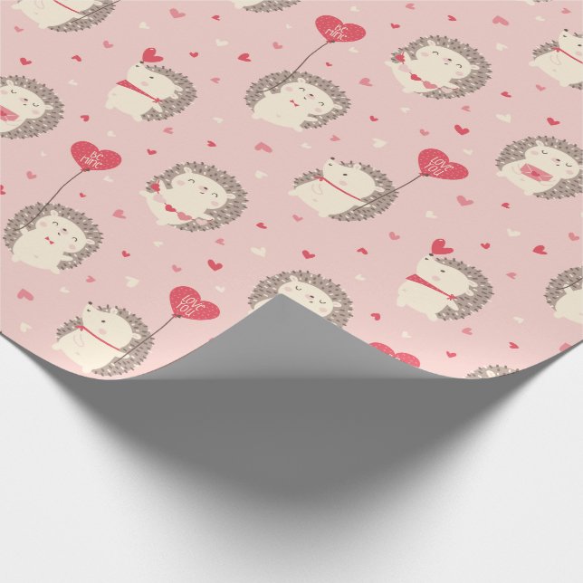 Cute valentine's hedgehogs with hearts on pink wrapping paper (Corner)