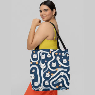 Cute white cats with orange accents on a dark blue tote bag