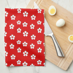 Cute white flowers on red tea towel