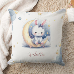 cute white little bunny sitting on the moon cushion