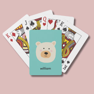 Cute white polar bear playing cards
