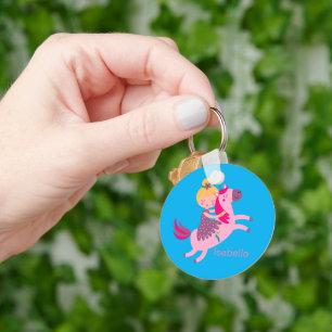 Cute Yellow Haired Girl Riding on a Unicorn Key Ring