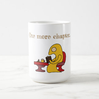 Cute yellow monster reading in a cafe  coffee mug