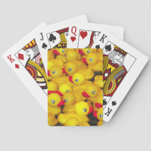 Cute yellow rubber duckies playing cards
