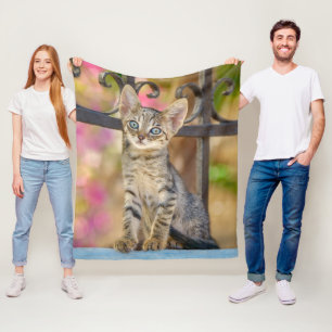 Cute Young Tabby Kitten with Blue Eyes in a Garden Fleece Blanket