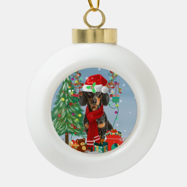 Dachshund Dog in Snow with Christmas Gifts Ceramic Ball Christmas Ornament (Front)
