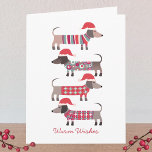 Dachshund Dogs in Santa Hats Christmas  Note Card<br><div class="desc">Adorable little Christmas Dachshund Wiener or Sausage dogs in cosy winter knitwear and Santa hats.  Customise by changing the greetings on the front and inside,  and change or remove the names.</div>