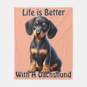 Dachshund Puppy Sitting and Looking with Innocent  Fleece Blanket