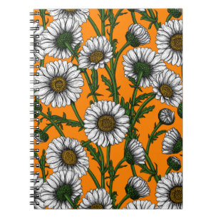 Daisies on orange notebook