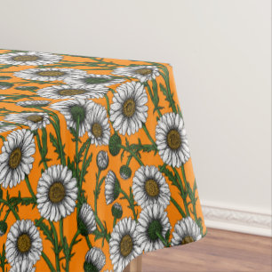 Daisies on orange tablecloth