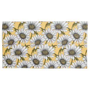 Daisies on yellow pillowcase