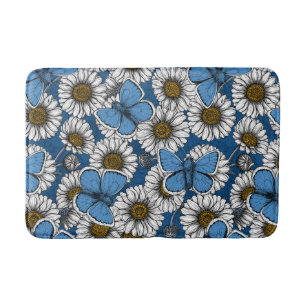 Daisies, white wild flowers and blue butterflies bath mat