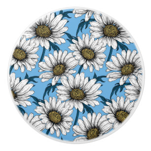 Daisies, wild flowers on blue ceramic knob