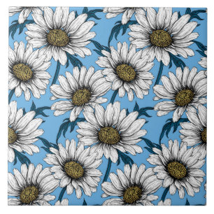 Daisies, wild flowers on blue tile