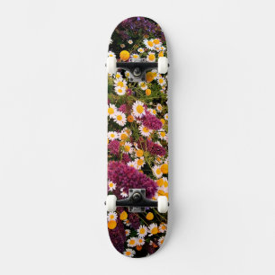 Daisy and purple flowers skateboard