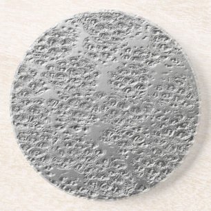 Damaged silver metal coaster