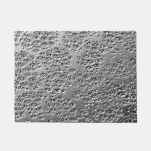 Damaged silver metal doormat