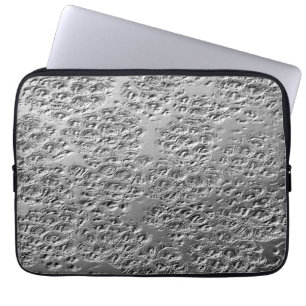 Damaged silver metal laptop sleeve