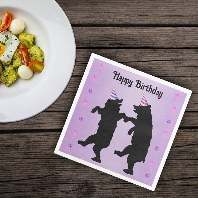 Dancing Black Bears Party Hats Stars on Purple Napkin (Dancing black bears wearing party hats rows of pink stars on Happy Birthday purple paper napkins.)
