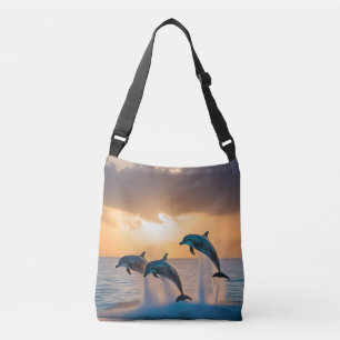 Dancing in the Dusk: Three Dolphins Leaping  Crossbody Bag