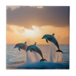 Dancing in the Dusk: Three Dolphins Leaping  Tile<br><div class="desc">Pictured On A Cloudy Sunset Are Three Dolphins Leaping.</div>