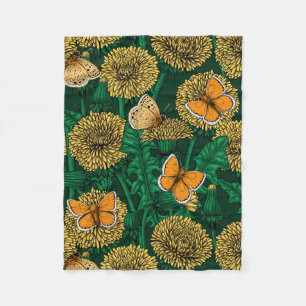 Dandelion meadow on dark green fleece blanket