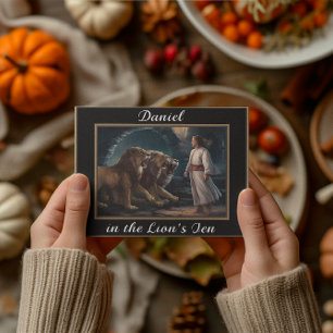 Daniel standing in the lions den black postcard