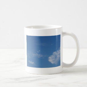 dark blue sky white clouds coffee mug