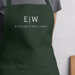 Dark Green Elegant Modern Minimalist Monogram Name Apron<br><div class="desc">Elevate your culinary experience with our Classic Elegant Modern Minimalist Monogram Name Cooking Apron. This kitchen essential seamlessly merges timeless elegance with contemporary minimalism. Crafted with precision, this apron is not just a practical accessory but also a statement of personal style. The customisable monogram and name option allows you to...</div>