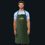 Dark Green Tan Monogram Personalised Apron<br><div class="desc">This personalised apron features a tan monogram initial and white retro script name on a dark green background. It makes a great Father's Day gift for the man who loves to grill or cook!</div>