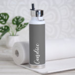 Dark Grey Personalised Wedding Bridesmaid Water Bottle<br><div class="desc">Gift your wedding bridesmaid or maid of honour with this trendy, vacuum Insulated water bottle that features her name in white, stylised script on a dark grey colour background designed to match your wedding colour scheme. Personalise bottle by editing and replacing name with your own as desired. Select your water...</div>