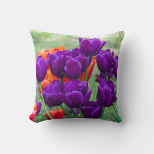 Dark purple tulips on a sunny day in the garden cushion