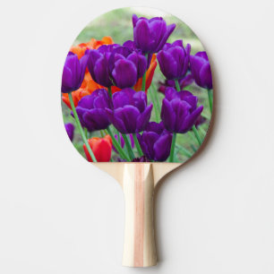 Dark purple tulips on a sunny day in the garden ping pong paddle