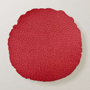 Dark red artificial leatherette closeup. round cushion