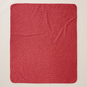 Dark red artificial leatherette closeup. sherpa blanket