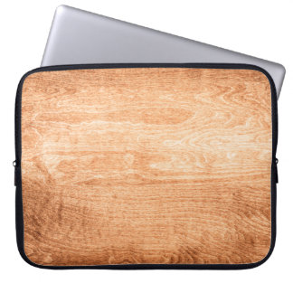 Dark wood texture background surface with old natu laptop sleeve