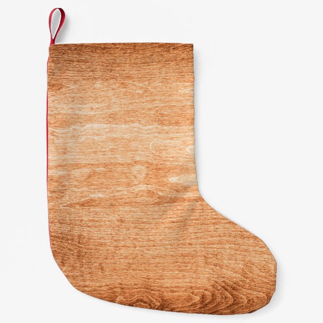 Dark wood texture background surface with old natu small christmas stocking (Front)